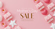 Mother's Day sale banner. A pink background with a pink heart and a pink box with a bow on it. The box is labeled 
