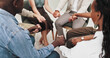 © peopleimages.com - Group therapy, counseling or people holding hands or praying for support, empathy or solidarity at rehab center. Help, psychology or friends with safety prayer circle for trauma, healing or gratitude