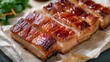 Top view of crispy pork belly or deep fried pork slice on white baking paper background. Asian Food