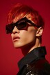 Dynamic fashion photo showcasing a man's red hair, edgy sunglasses, and a modern shiny black jacket