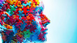 A human head created entirely from vibrant, colorful puzzle pieces, showcasing creativity and diversity