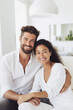 © Aleksandr - Multiracial couple at home.