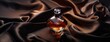 © lililia - a men's perfume with a top-down photograph of the bottle resting on a luxurious dark brown silk fabric, capturing the essence of elegance and refinement in high resolution.