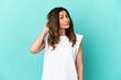 © luismolinero - Middle aged caucasian woman isolated on blue background having doubts