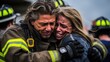 Scared young woman hugs brave fireman saved girl from fire during rescue operation on street