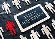 Recruitment and talent acquisition. Unique and different figure in the crowd, Talent acquisition concept. Small plaque and small wooden figures,