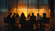 A group of people are sitting around a table in a dimly lit room