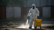 Men in protective clothing sprayed to disinfect contaminated areas.generative.ai