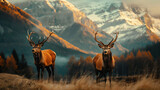 A pair of deer with mountains