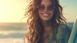 attractive woman with long curly hair, wearing sunglasses and holding surfboard on the beach smiling, with tattoos