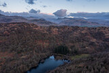 Fototapeta Londyn - Beautiful, aerial drone landscape image of Lake District during Spring vibrant sunset