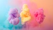 Cotton candy on sticks in teal, pink and lavender hues with dreamy smoke effect. Abstract pastel background