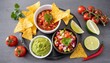  Mexican food- salsa sauce, guacamole and pico de gallo with nacho chips 