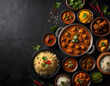 Assorted indian food on black background.. Indian cuisine. Top view with copy space