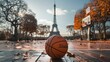 basketball ball with the eiffel tower in daytime background in high resolution