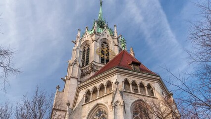 Sticker - St. Paul's Church or Paulskirche timelapse. Looking up perspective. A large Catholic church in the Ludwigsvorstadt-Isarvorstadt quarter of Munich, Bavaria, Germany. Back side view