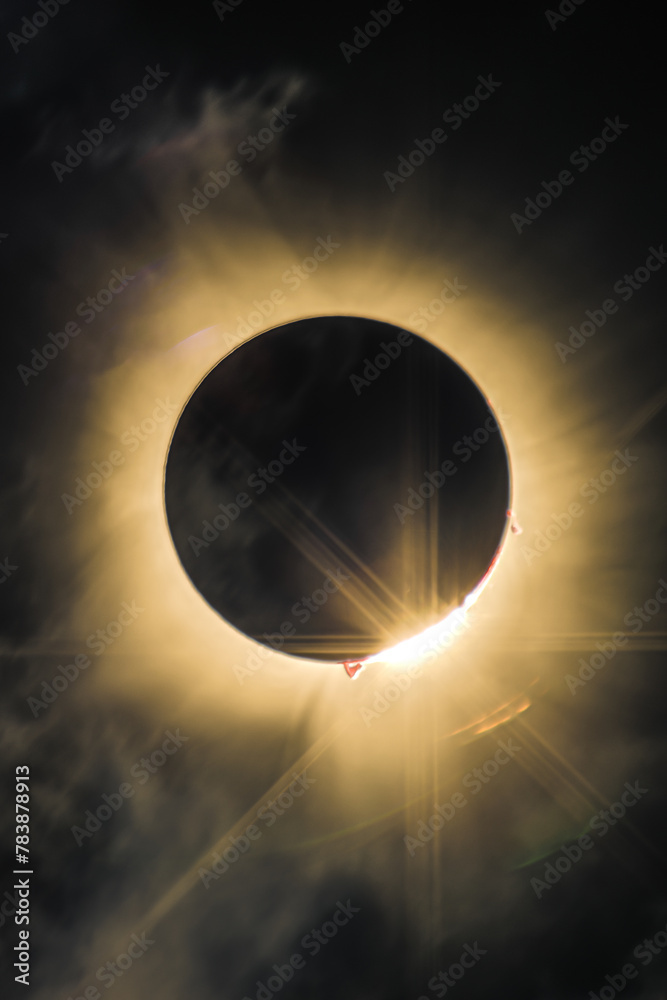 Total solar eclipse of April 8th 2024 with the sun peaking from behind ...