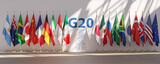 Fototapeta Boho - G20 summit or meeting concept. Row from flags of all members of G20 Group of Twenty and list of countries.