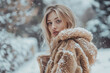 A woman is wearing a fur coat and standing in the snow. She has a serious expression on her face