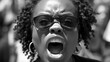 Close-up portrait of an African-American woman shouting slogans for the rights of black people. Black Freedom Day.