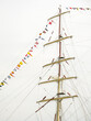 Close up of the rigging and signal flags of a full rigged ship during the Tall ship Festival, Greenwich, UK