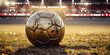 Old shabby golden football ball on field grass of stadium after final match of championship. Soccer game on illuminated sports arena