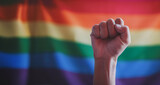 Fototapeta  - man protests with raised fist on gay pride day