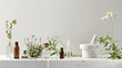 Homeopathy essentials, including glass vials of herbal extracts, medicinal herbs, mortar, pestle, and selection of homeopathic remedies, on a white background. Alternative medicine. Banner. Copy space