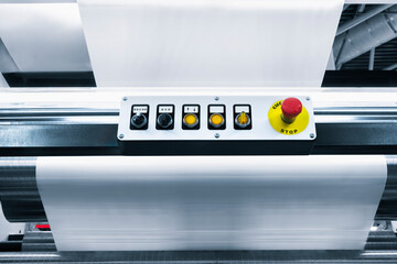 Poster - A machine with a red button and yellow buttons. The buttons are numbered 1 through 5. The machine is used to print paper