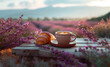 Cup of aromatic coffee with croissant on the background of a lavender field