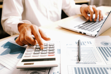 Poster - businessman accountant or financial expert analyze business report graph and finance chart at corpor