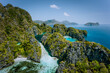 Aerial drone view of turquoise big and small lagoons surrounded by steep rocks, Marine National Reserve in El Nido, Palawan