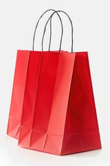Poster - A simple red paper shopping bag on a white surface. Suitable for various shopping or retail concepts