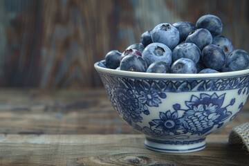 Poster - Fresh blueberries in a blue and white bowl, perfect for healthy eating concepts