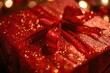 A red gift box with a red bow on top. Perfect for holiday and celebration concepts