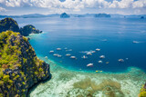 Fototapeta Do pokoju - Miniloc island, Palawan, Philippines. Aerial view of tourism day trip boats on island hopping tour at big lagoon entrance