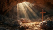 Cross in a dusty cave in the rays of sun