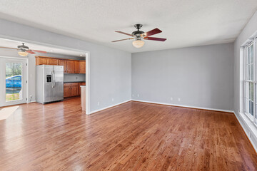 Wall Mural - interior of simple ranch style home in the country with original oak hardwood floors, gray walls and white trim. Empty home. Stage with any furniture you would like. 