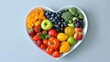 © buraratn - Nutritional food for heart health wellness by cholesterol diet and healthy nutrition eating with clean fruits and vegetables in heart dish by nutritionist