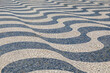 Undulating, Dizzying Waves of Black and White Limestone Tiles on a Sidewalk in Lisbon, Portugal