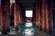Old rusty pier in clear water