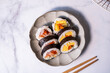 the Top view of sushi cut roll for Japanese food background. cooking and eating concept.