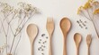 Sleek wooden spoons and forks, arranged artfully in a minimalist, sustainable kitchen setting