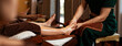 Selective focus on hand, Masseuse acupressure massage on feet of customer. Masseuse service foot massage to woman customer. Relaxation foot massage in cosmetology spa centre.