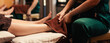 Close up, Professional masseuse acupressure massage on feet of customer. Masseuse service foot massage to woman customer. Relaxation foot massage in cosmetology spa centre.