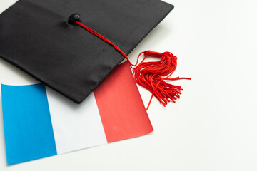 Wall Mural - Graduation cap with red tassel isolated on white background