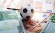 Soccer ball on stack of euro