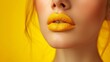 Vibrant Yellow Lipstick on Female Model's Pout in Close-Up Shot Against Monochromatic Background