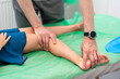 © Iryna - Orthopedic insole. The orthopedist works with the patient. Orthopedic clinic. Choice of insoles in an orthopedic clinic. The orthopedist offers the insole to the patient Foot care