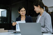 © NINENII - Businessmen team or financial data analysts working with tablets and laptop computers and data graphs together.
